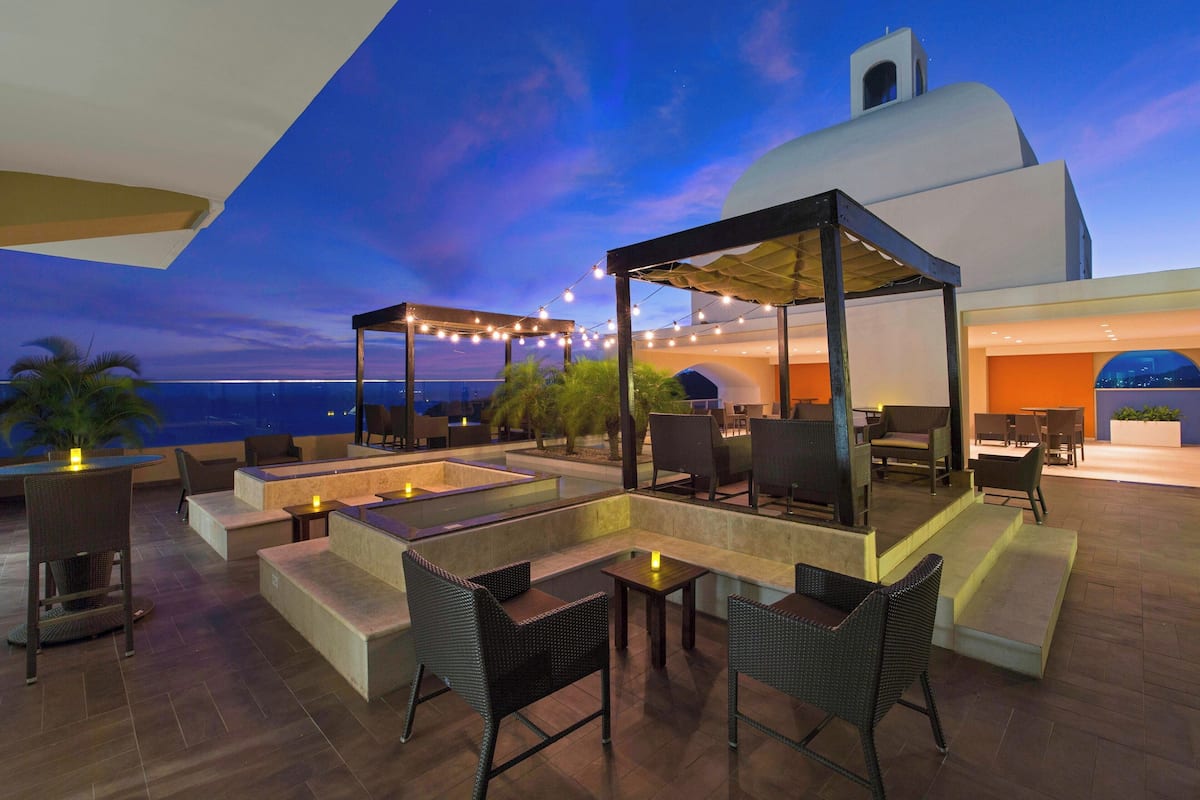 2 bars/lounges, 2 poolside bars, swim-up bar