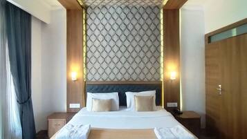 Deluxe Room | Premium bedding, desk, blackout curtains, iron/ironing board