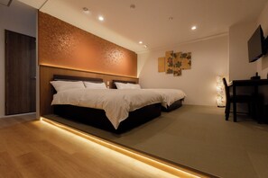 A modern hotel room with two beds, a desk, and a television. - Miro Hotel Dotonbori (Osaka)