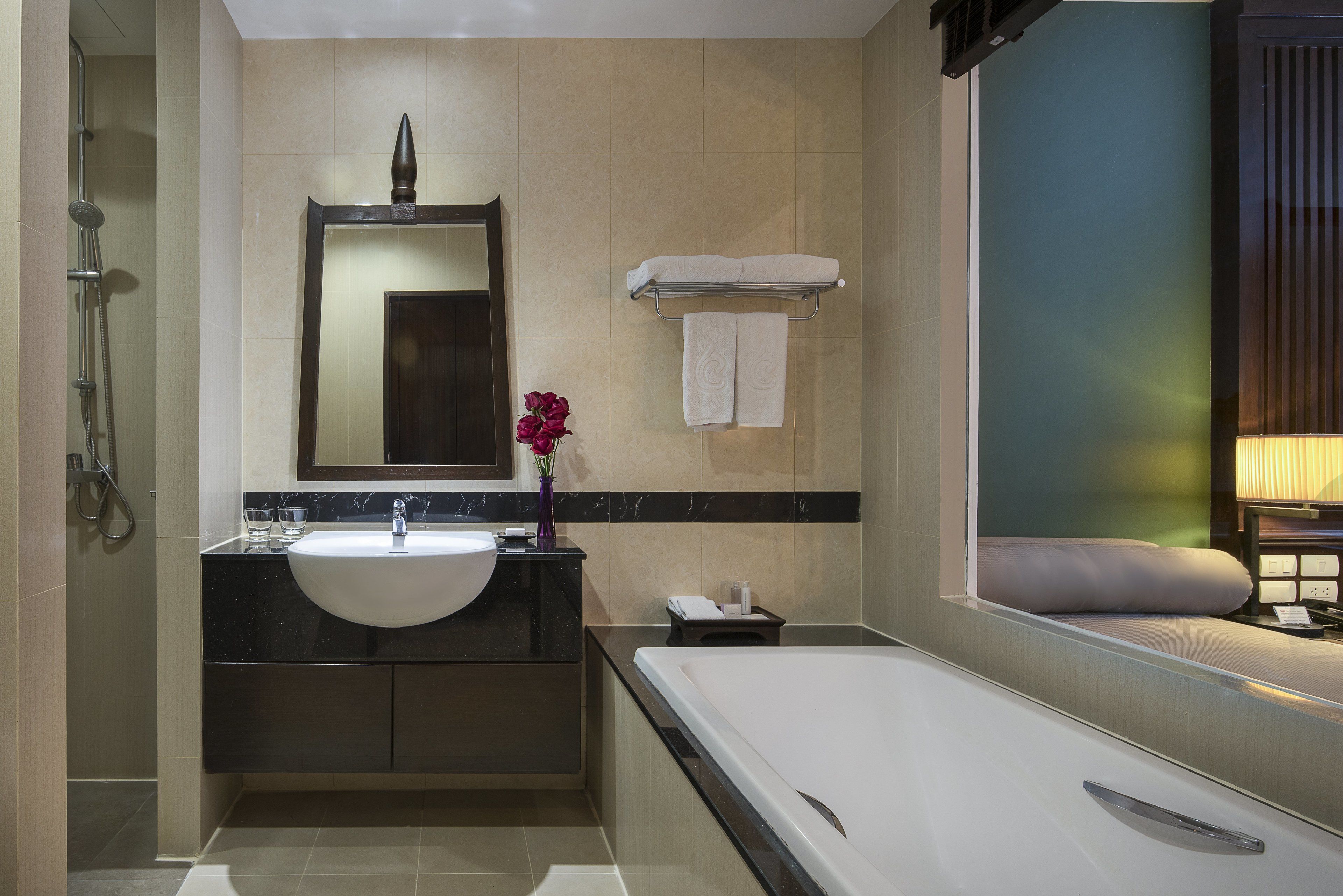 family suite, 1 king bed, pool view | bathroom | combined shower/bathtub, deep-soaking bathtub, rainfall showerhead