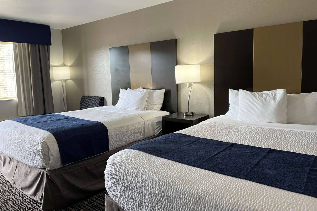 Room, 2 Queen Beds, Smoking | Desk, cribs (free), WiFi (free), bed sheets