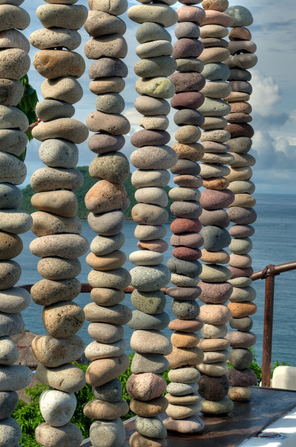 A series of balanced stone stacks.