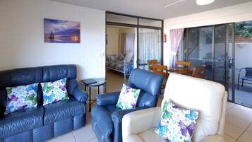 Standard Apartment, 1 Bedroom, Ocean View, Courtyard Area | Living area | 42-inch TV with digital channels, DVD player, toys