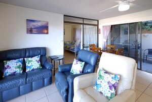 Standard Apartment, 1 Bedroom, Ocean View, Courtyard Area | Living area | 42-inch TV with digital channels, DVD player, toys