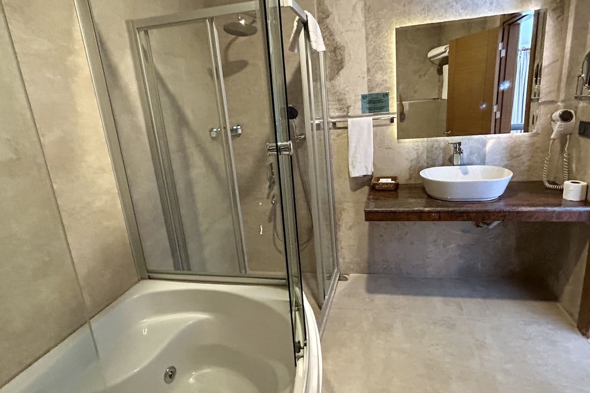 family room | bathroom | shower, free toiletries, hair dryer, slippers