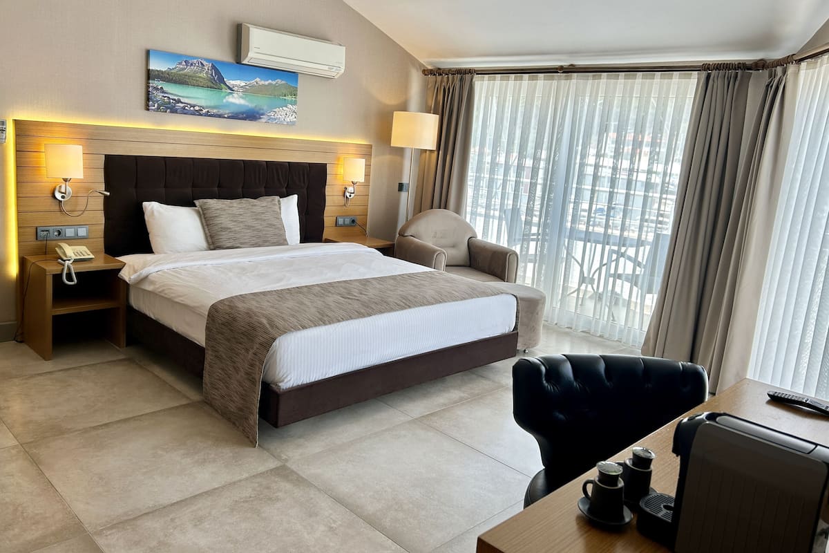 family room | 1 bedroom, minibar, in-room safe, desk