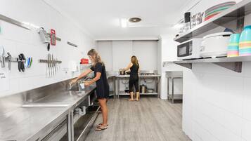 Fridge, microwave, stovetop, cookware/dishes/utensils