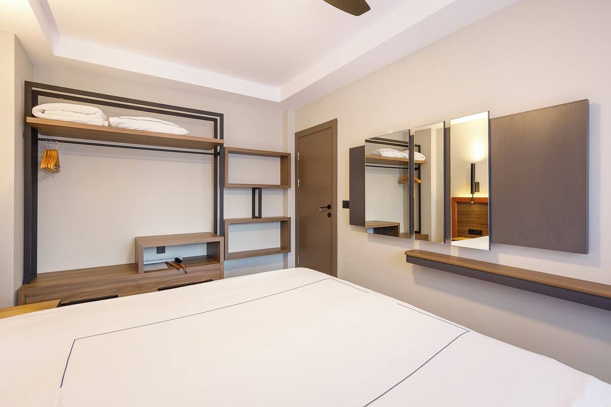 desk, blackout curtains, soundproofing, rollaway beds