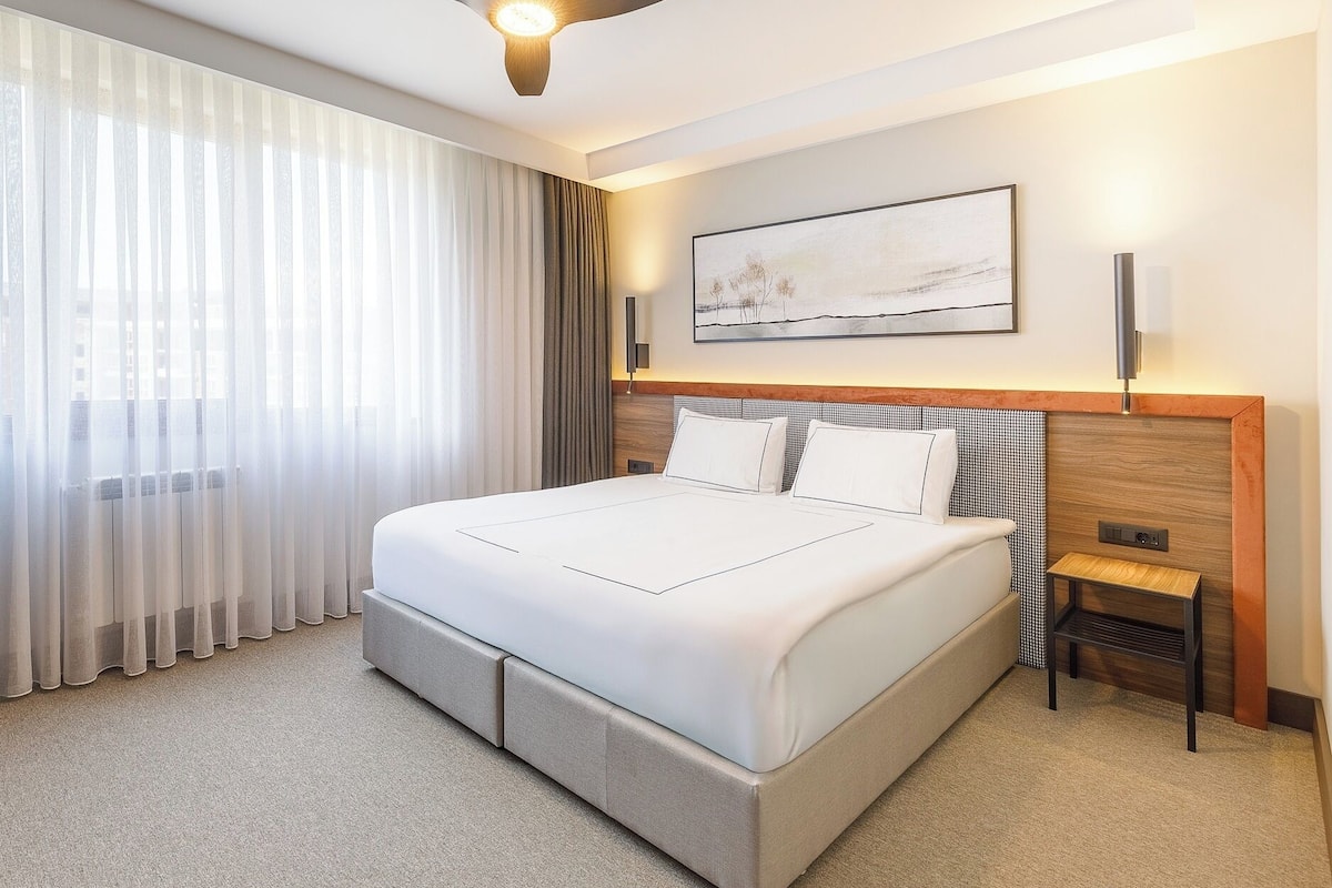 Desk, blackout curtains, soundproofing, rollaway beds