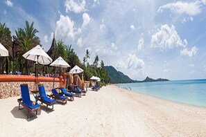 On the beach, sun-loungers, beach umbrellas, beach towels