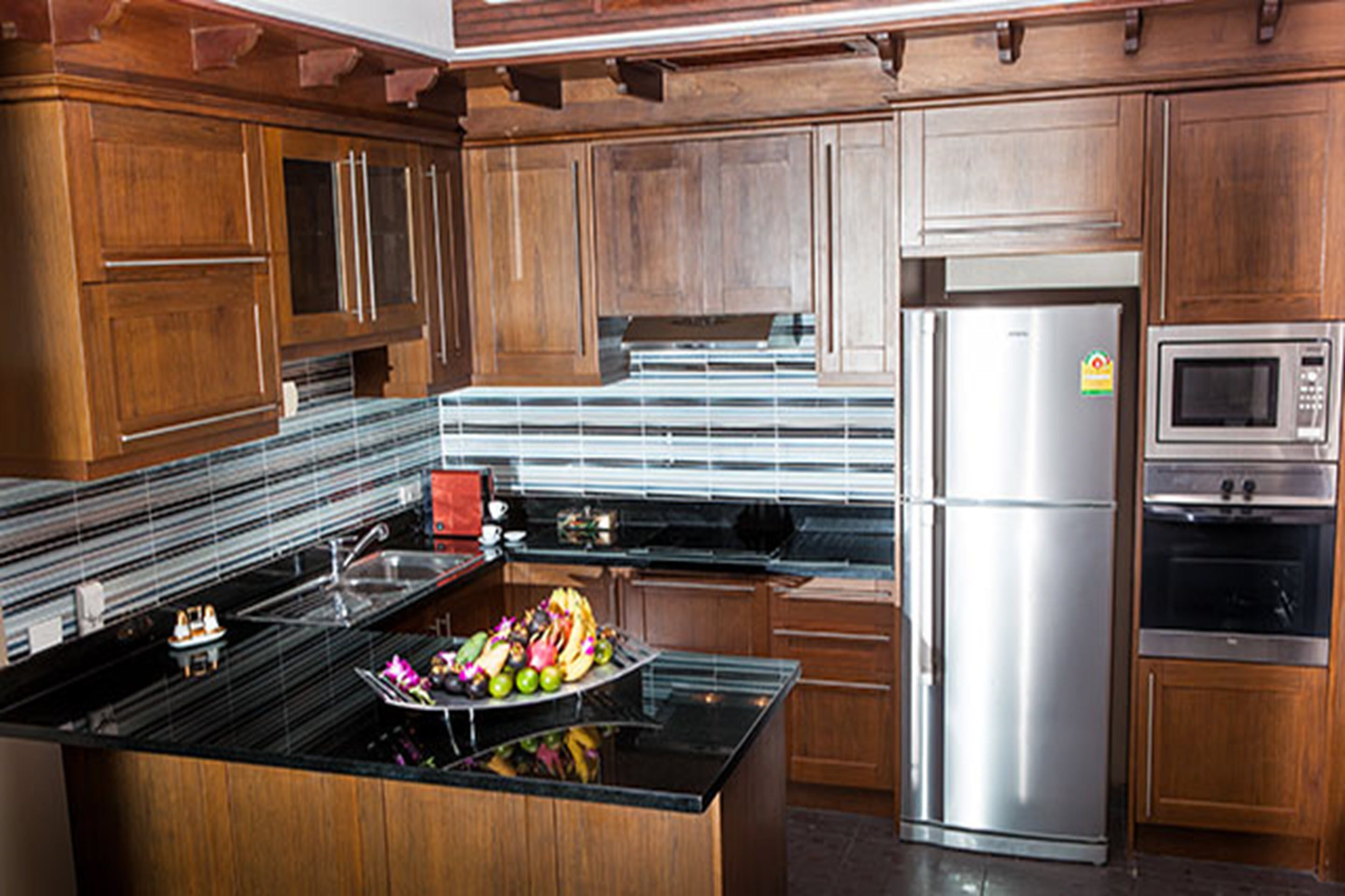 villa, multiple beds, private pool, beachfront | private kitchen | full-sized fridge, microwave, coffee/tea maker