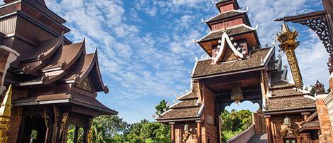A traditional temple with tiered roofs and intricate woodwork.