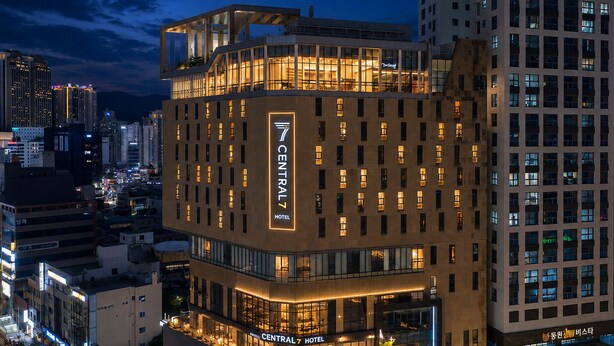 A multi-story hotel with illuminated signage, large windows, and a modern architectural design. - Central Seven Hotel by Kwon Busan Seomyeon (Busan)