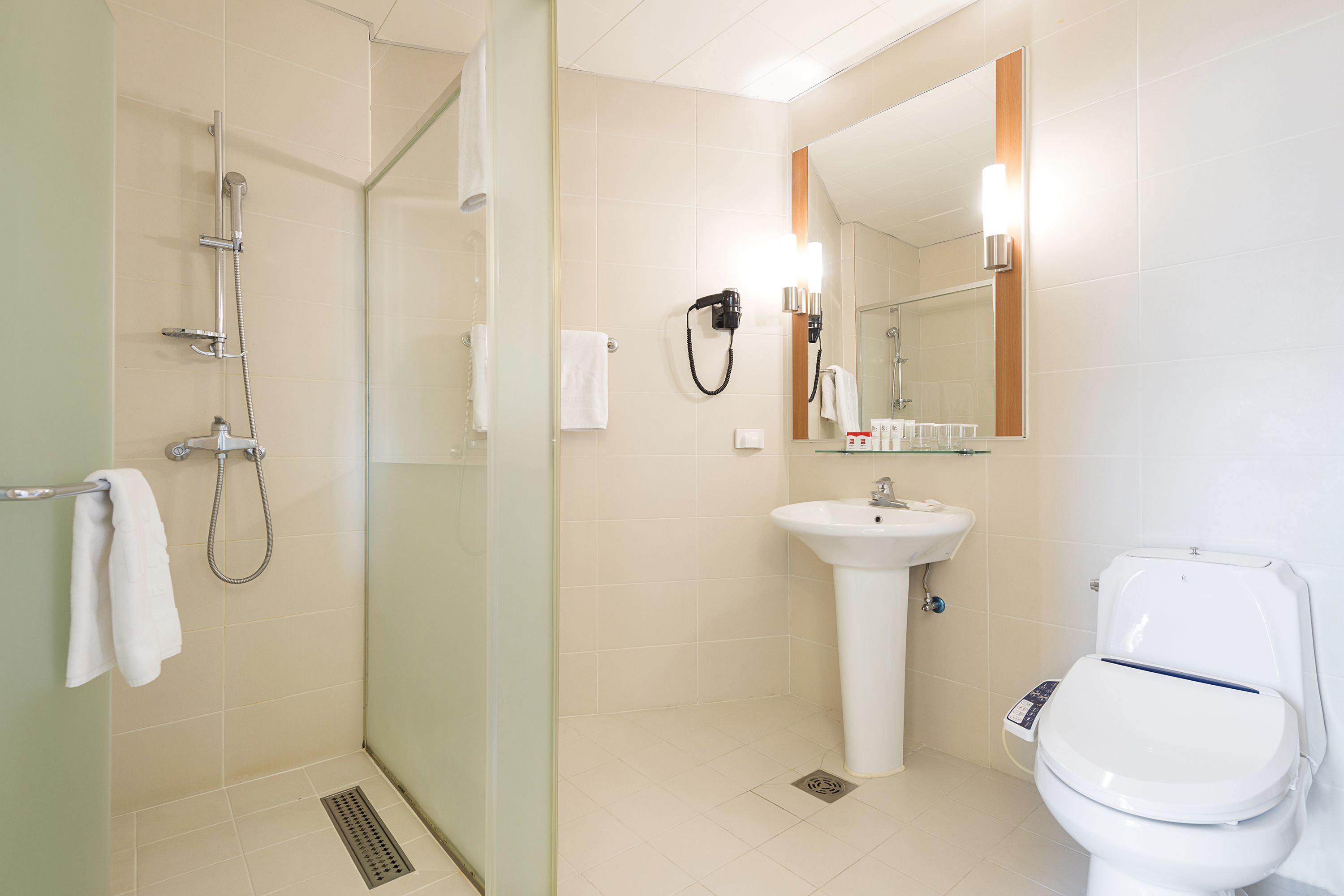 shower, eco-friendly toiletries, hair dryer, slippers