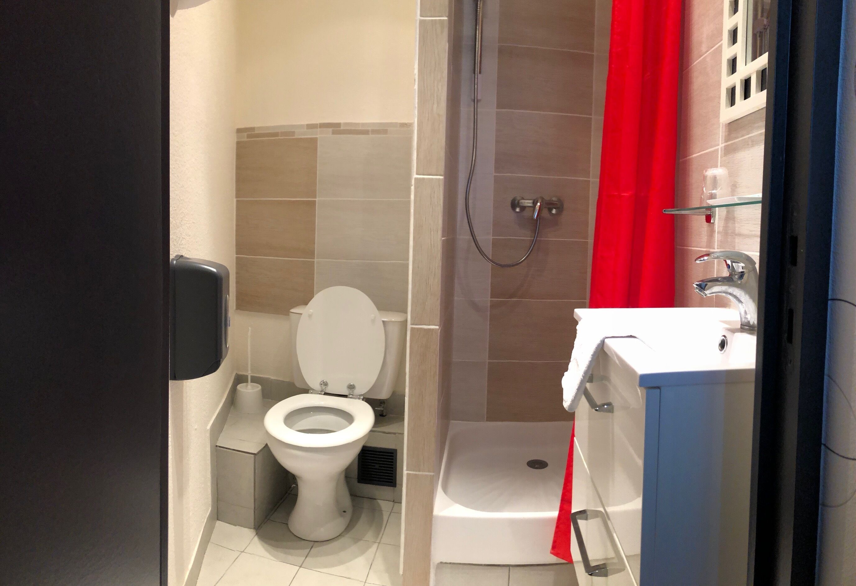 double room with shower | bathroom | hair dryer, towels, soap, toilet paper