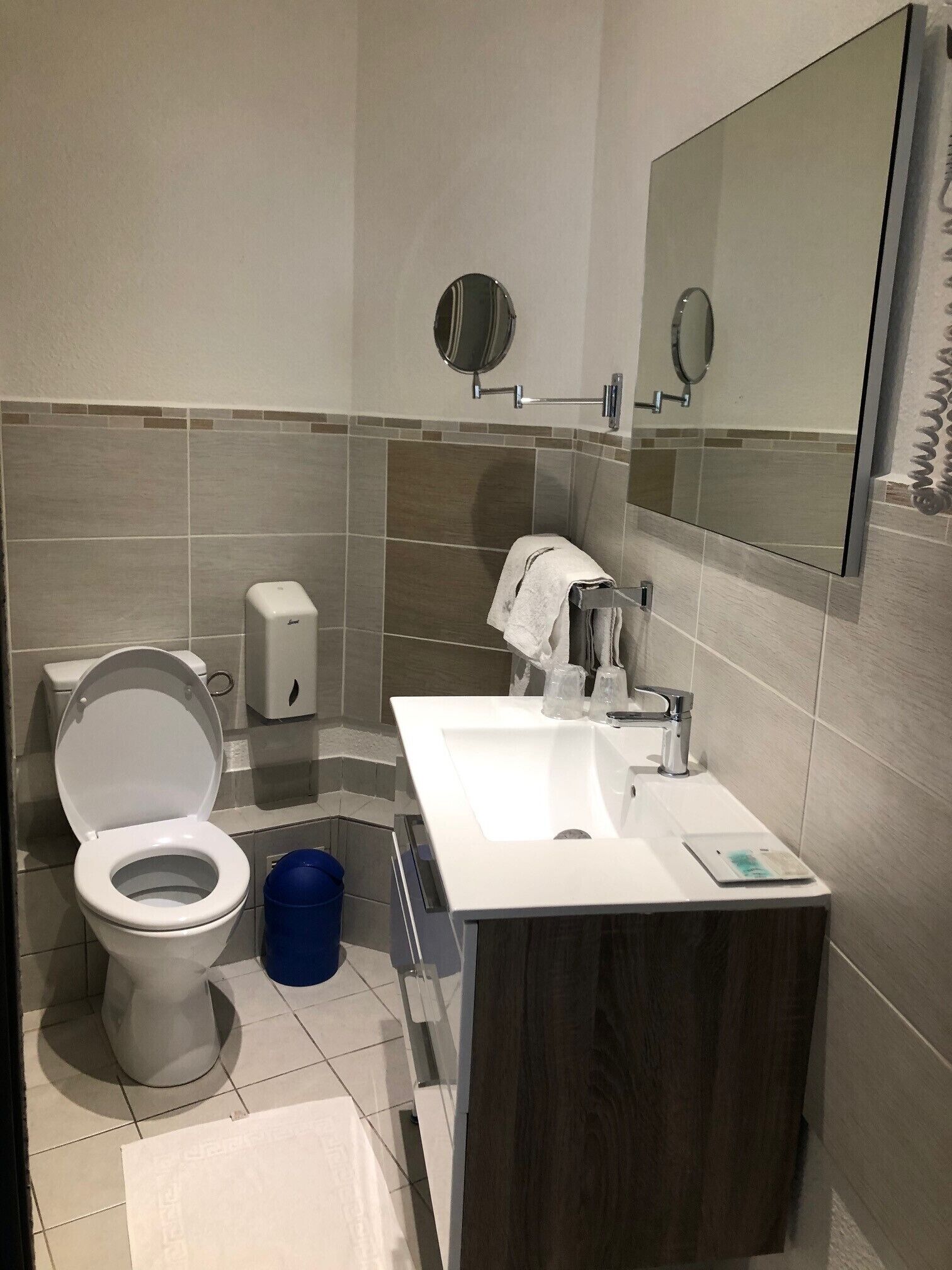 double room with shower | bathroom | hair dryer, towels, soap, toilet paper