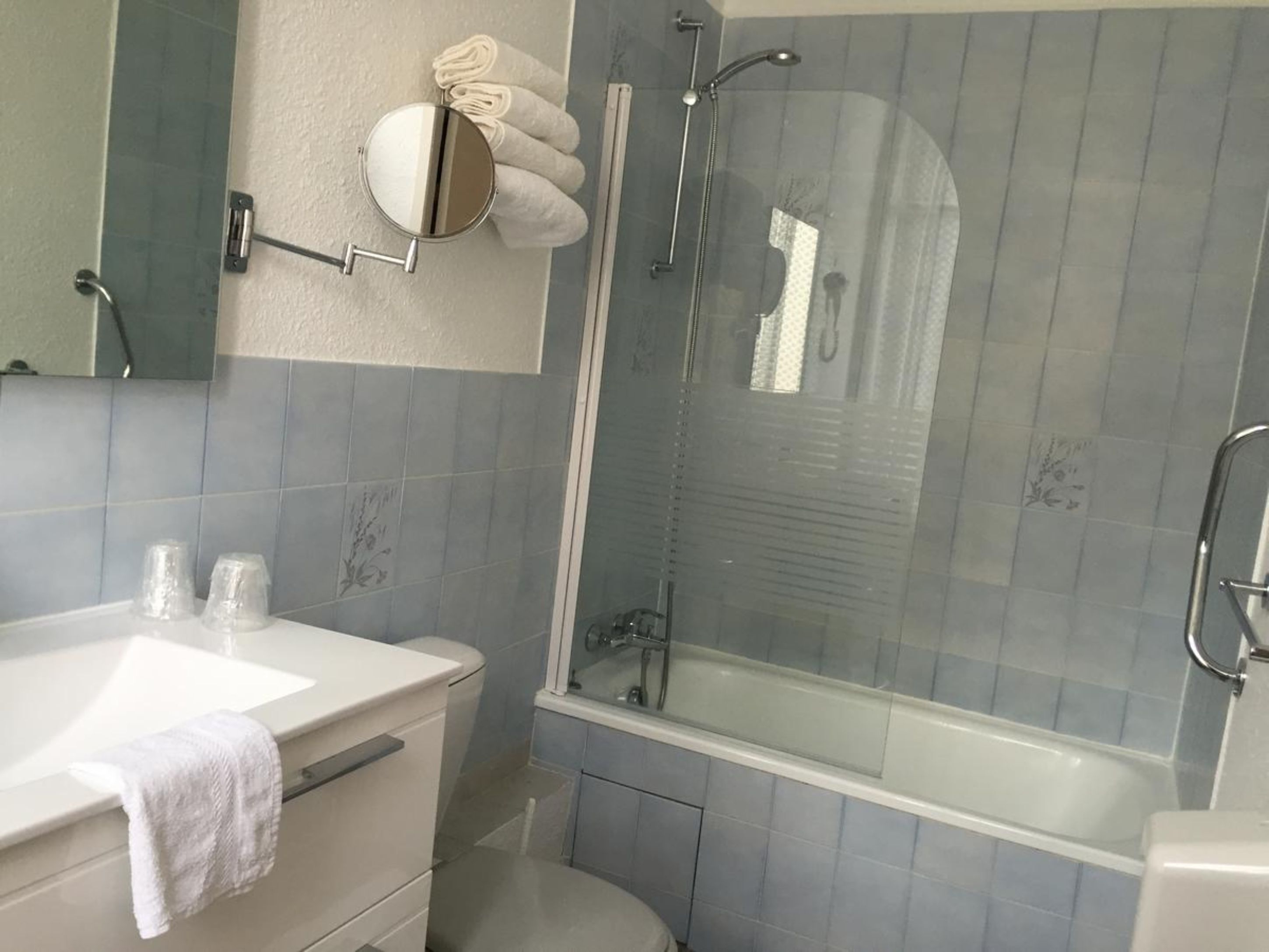 superior double room | bathroom | hair dryer, towels, soap, toilet paper