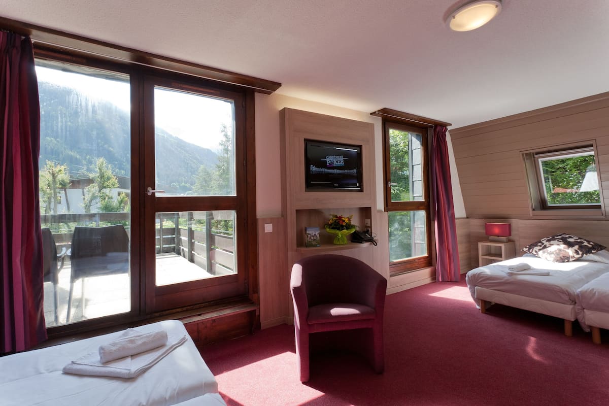 Triple Room (with Spa Access) | Living area | Flat-screen TV
