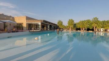 Seasonal outdoor pool, open 10 AM to 7:30 PM, pool umbrellas
