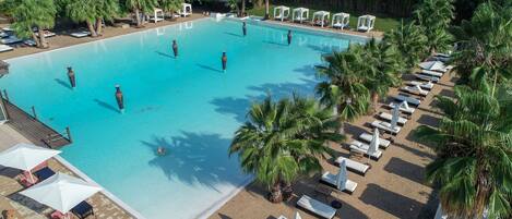 Seasonal outdoor pool, open 10 AM to 7:30 PM, pool umbrellas