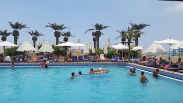 Seasonal outdoor pool, open 9:00 AM to 5:30 PM, pool umbrellas