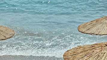 On the beach, sun loungers, beach umbrellas, beach towels