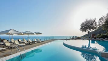 Indoor pool, outdoor pool, pool umbrellas, pool loungers