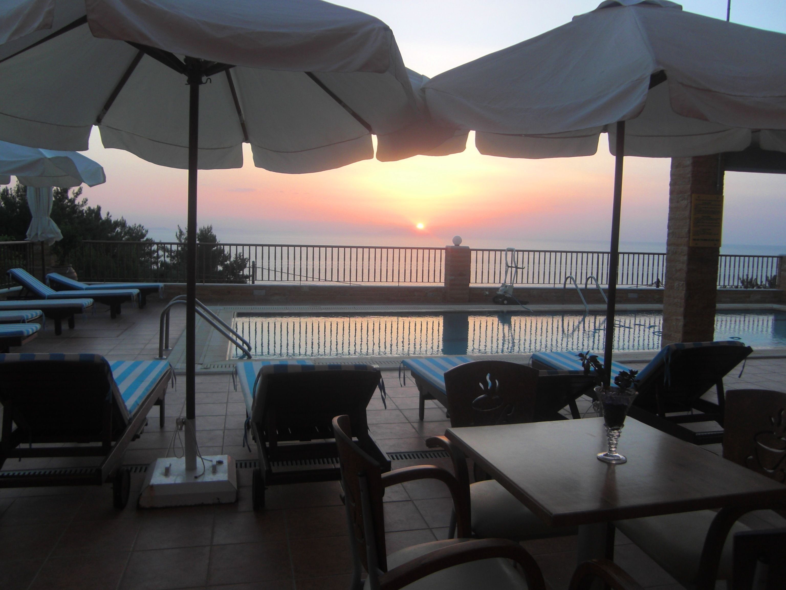 outdoor pool, open 11:00 am to 7:00 pm, pool umbrellas, pool loungers