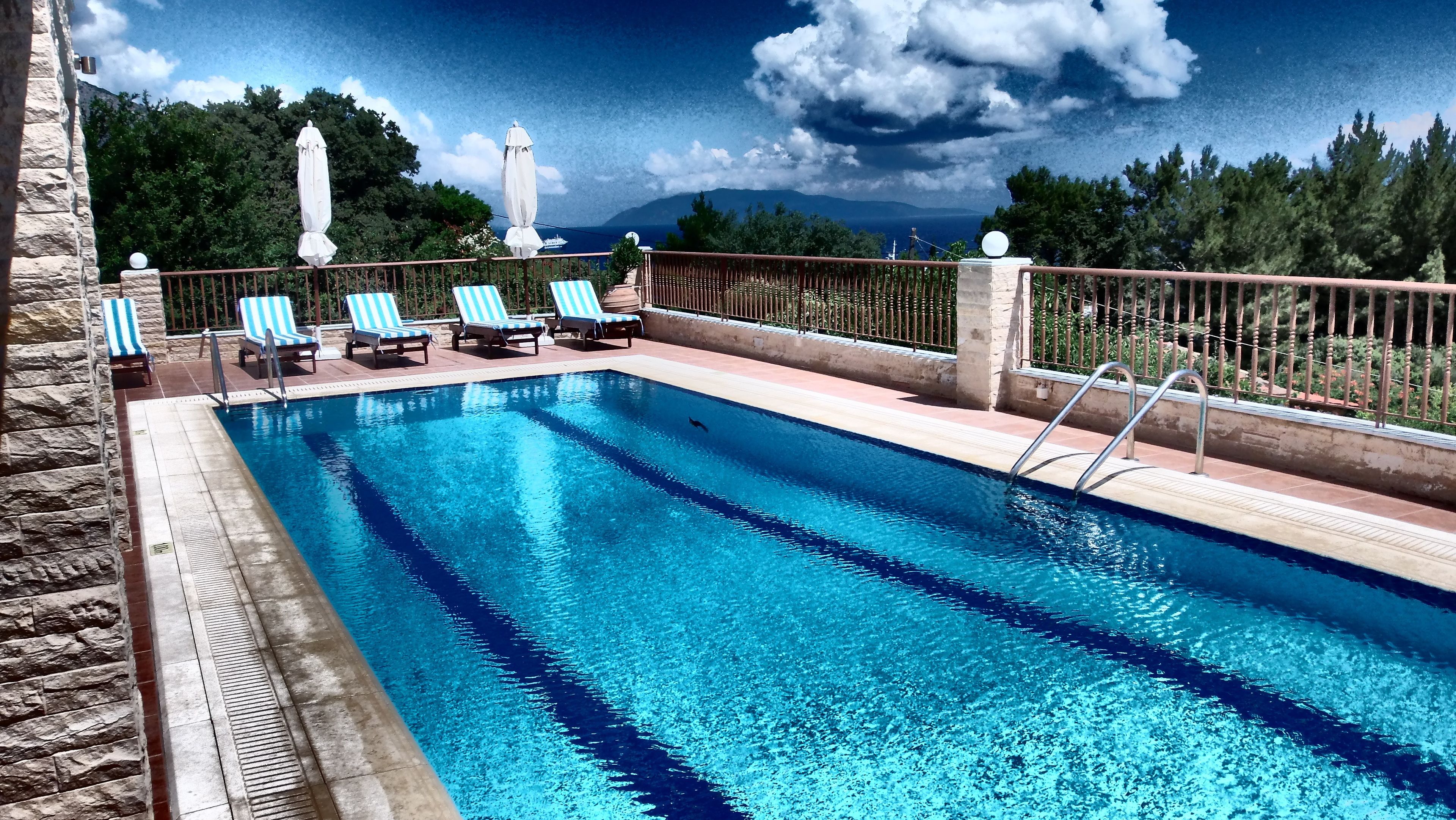 outdoor pool, open 11:00 am to 7:00 pm, pool umbrellas, pool loungers