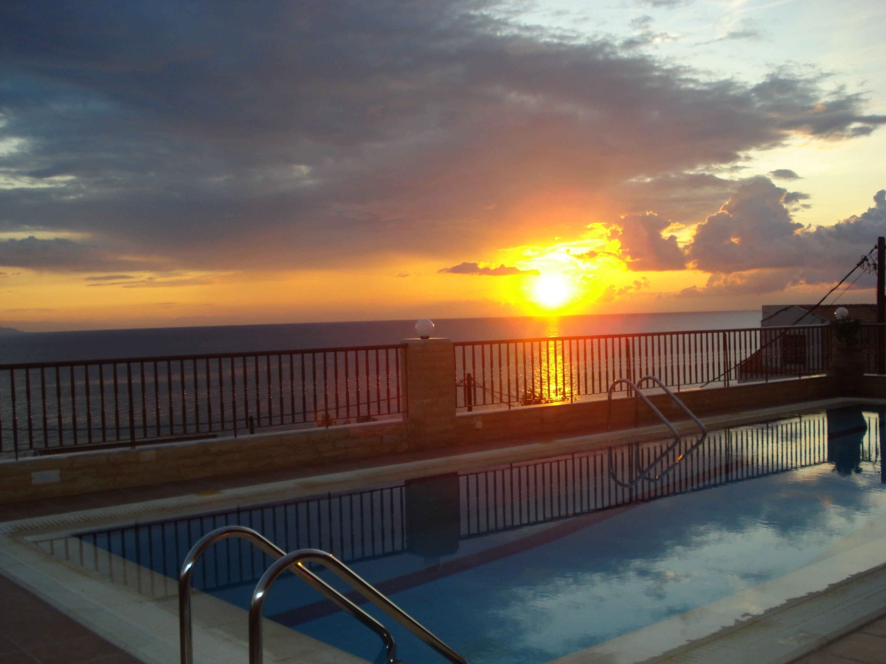 outdoor pool, open 11:00 am to 7:00 pm, pool umbrellas, pool loungers