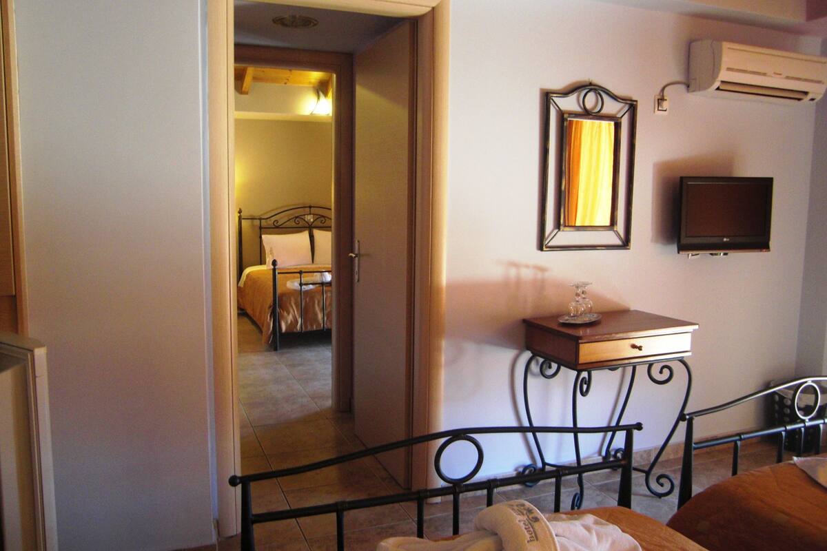 family room, sea view | premium bedding, in-room safe, desk, blackout curtains