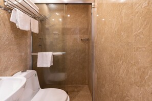 A modern bathroom with a glass-enclosed shower, a white toilet, and a towel rack with towels. - Rome Love Hotel (Rome)
