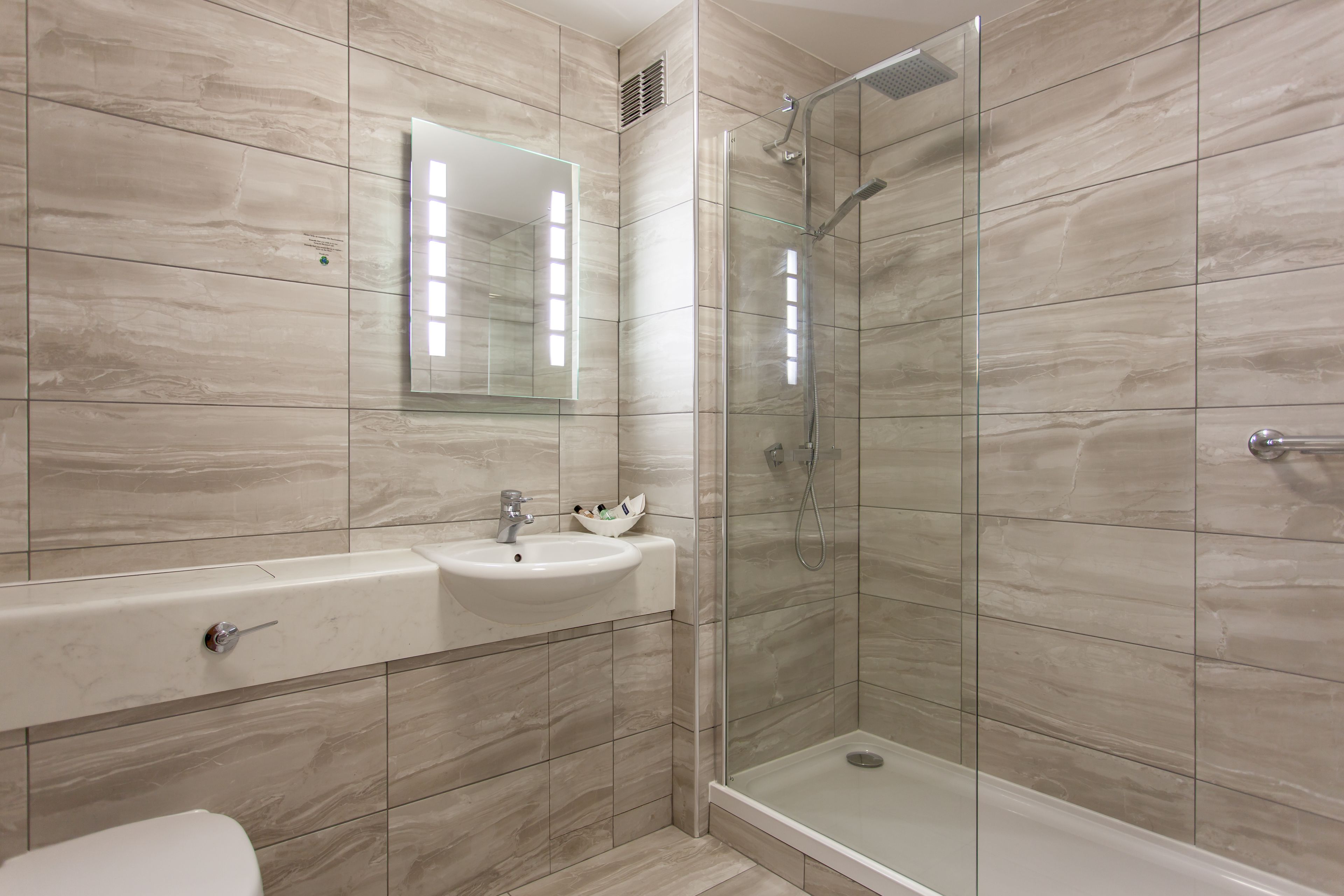 combined shower/bathtub, free toiletries, hair dryer, towels