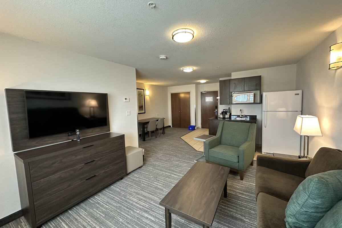 suite, 1 king bed, non smoking, kitchenette (dining table;with sofabed) | desk, laptop workspace, blackout curtains, iron/ironing board