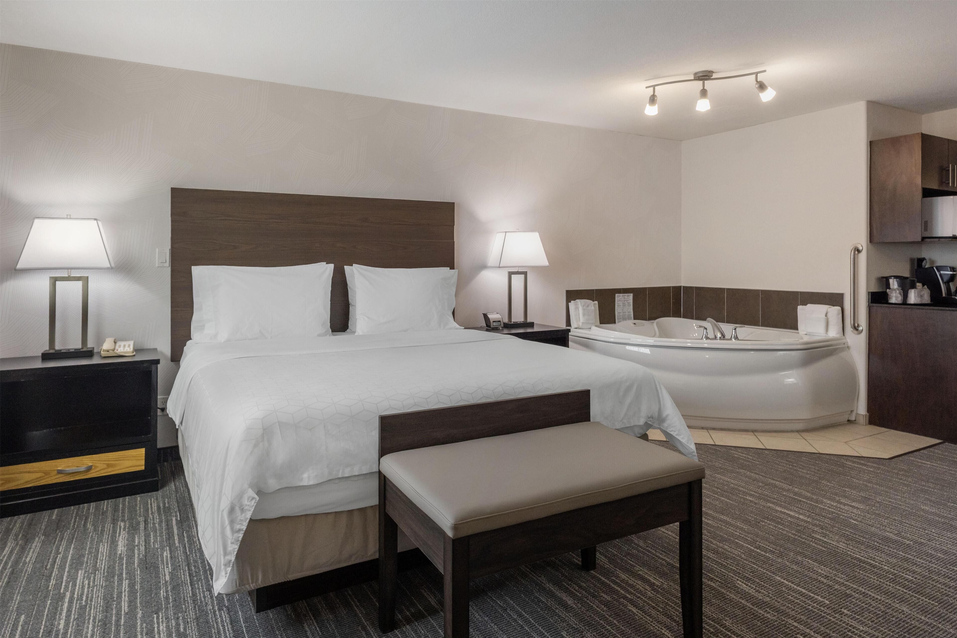 Suite, 1 King Bed, Non Smoking, Hot Tub (Dining Table) | Desk, laptop workspace, blackout curtains, iron/ironing board