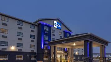 A Best Western hotel with a modern design, featuring a covered entrance and a well-lit facade.