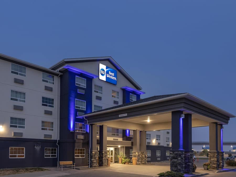A Best Western hotel with a modern design, featuring a covered entrance and a well-lit facade.