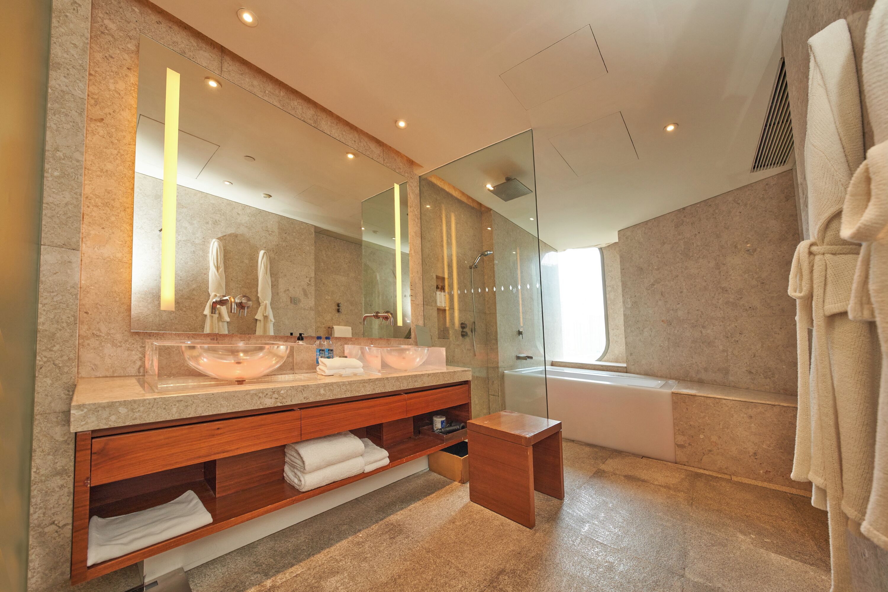 1 king bed deluxe | bathroom | designer toiletries, hair dryer, bathrobes, slippers