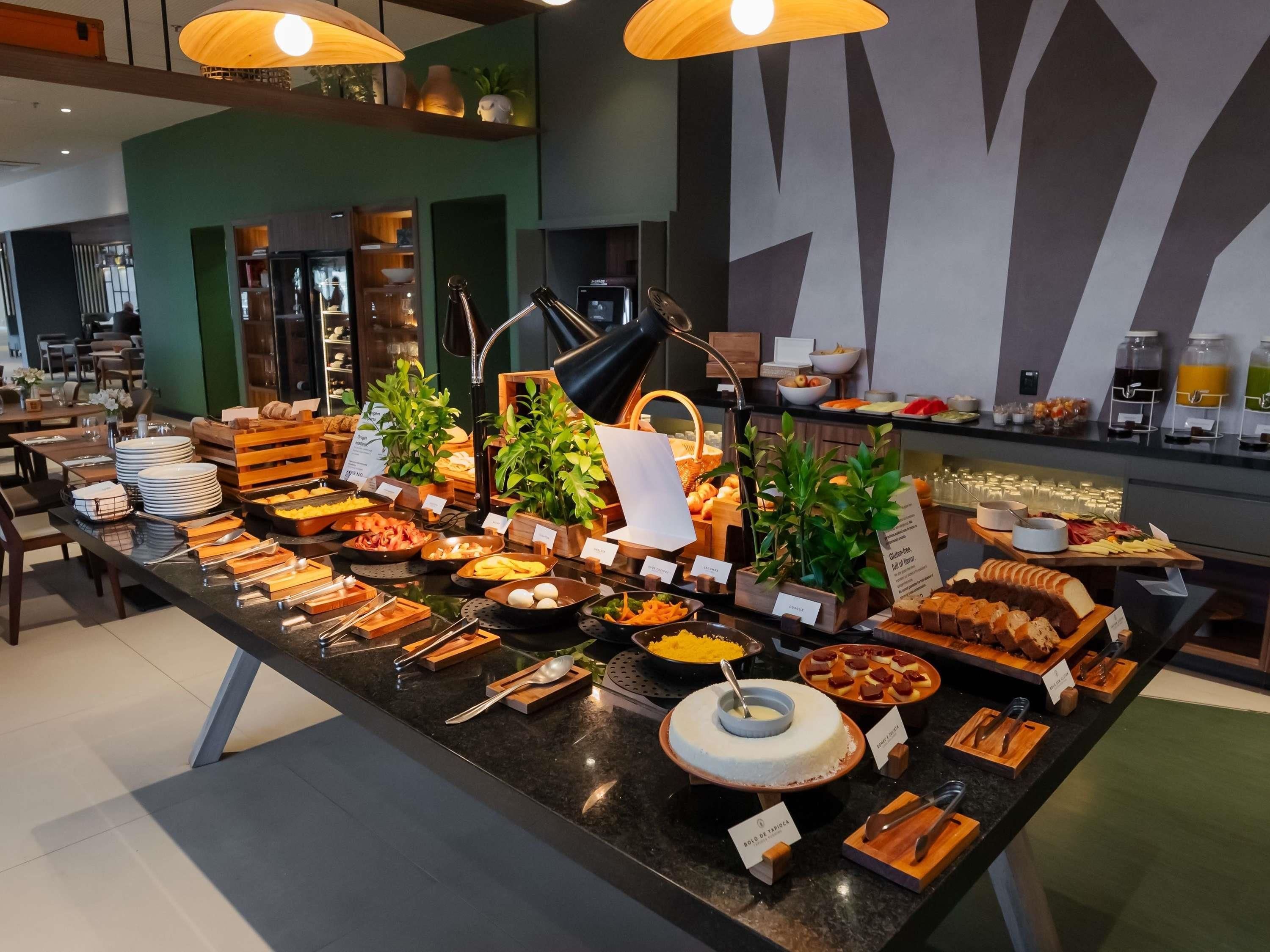 A buffet with various food items and a sign indicating it is gluten-free.