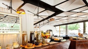 A breakfast bar with various food items and condiments. - Quentin Boutique Hotel (Berlin)
