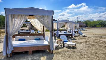 On the beach, sun loungers, beach umbrellas, beach towels