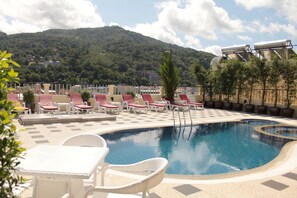 Outdoor pool, open 11:00 AM to 8:00 PM, pool loungers