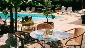 Seasonal outdoor pool, pool umbrellas, pool loungers
