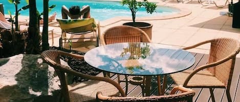 Seasonal outdoor pool, pool umbrellas, pool loungers