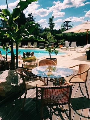 Seasonal outdoor pool, pool umbrellas, pool loungers