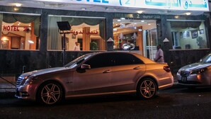 A multi-story hotel with balconies, a sign reading "DWEIK HOTEL (2)", and cars parked in front. - Dweik Hotel 2 (Aqaba)