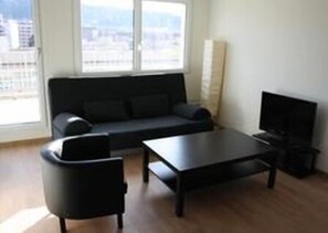 Quadruple Room, 2 Bedrooms, Terrace (Violet) | Living room | Flat-screen TV - Letzigrund Apartments (Zürich)