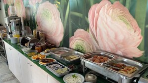 A buffet with various food items and a coffee station. - Anatoli Beach (Apokoronas)