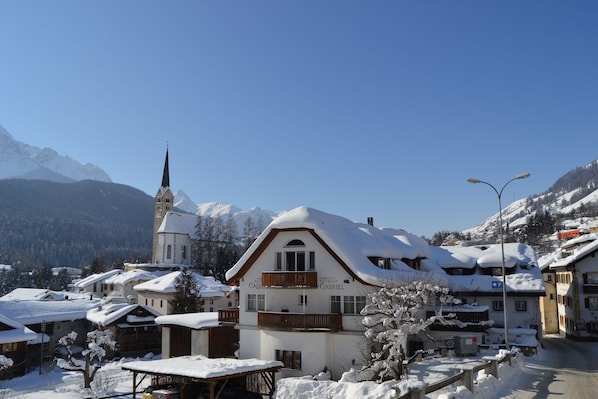 A snow-covered building with a sign reading "Hotel Gabriel."