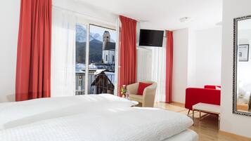 Premium bedding, down duvets, in-room safe, desk